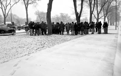 group of people standing outdoors in winter